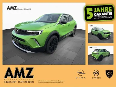 Gebraucht Opel Mokka Elegance 136 PS (100 kW) 2023 Lackierung matcha green/typ au SUV