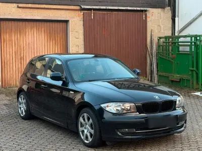 Gebraucht BMW 116 122 PS (89 kW) 2010 Schwarz Kleinwagen