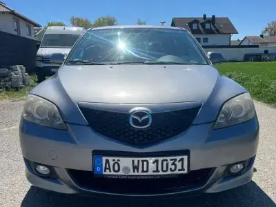 Używany Mazda 3 Comfort 105 KM (77 kW) 2004 Szary Sedan/Limuzyna