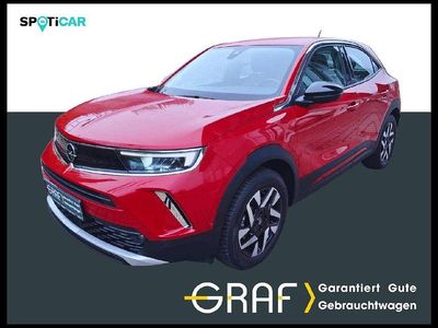 Gebraucht Opel Mokka 131 PS (96 kW) 2024 Rubin rot / dach schwarz SUV