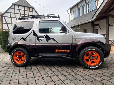 Second-hand Suzuki Jimny 86 CP (63 kW) 2012 Argintiu SUV