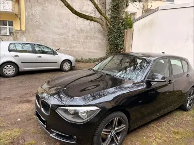 Gebraucht BMW 118 Sport Line 170 PS (125 kW) 2011 Schwarz Kleinwagen