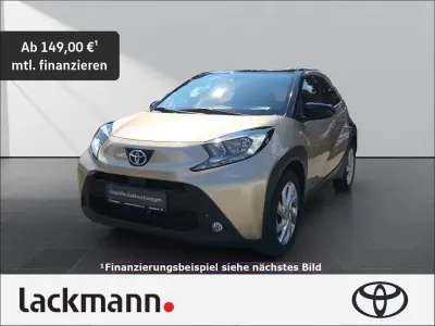 Gebraucht Toyota Aygo X Pulse 72 PS (52 kW) 2022 4u9)/ black mica (209) (beige SUV