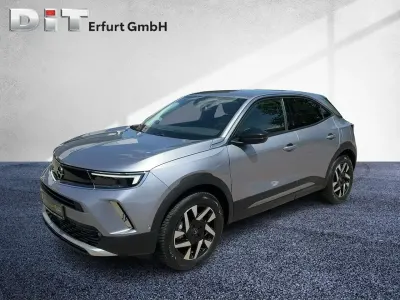 Gebraucht Opel Mokka-e Elegance 100 kW (136 PS) 2022 Kontrast grau/quarz silber SUV