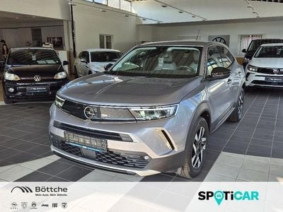 Gebraucht Opel Mokka Elegance 131 PS (96 kW) 2022 Kontrast grau/quarz silber SUV