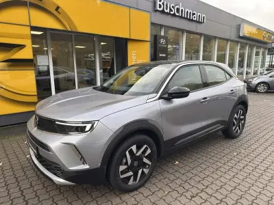 Gebraucht Opel Mokka-e Elegance 100 kW (136 PS) 2022 Kontrast grau metallic SUV