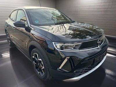 Gebraucht Opel Mokka-e drive 100 kW (136 PS) 2023 Diamant schwarz/karbon schwarz SUV