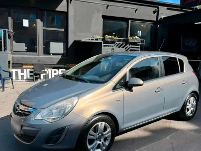 Usata Opel Corsa 69 CV (50 kW) 2011 Marrone Utilitaria