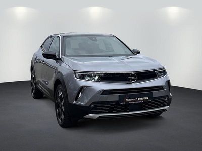 Gebraucht Opel Mokka Ultimate 131 PS (96 kW) 2023 Kontrast grau/quarz silber (metallic) SUV