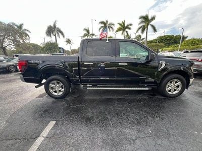 Gebraucht Ford F-150 XLT 436 PS (320 kW) 2024 Agate black metallic Pickup