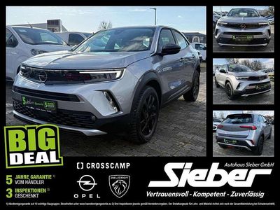 Gebraucht Opel Mokka Elegance 131 PS (96 kW) 2022 Kontrast grau/quarz silber SUV