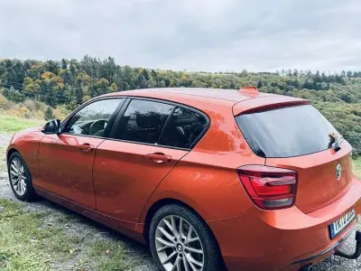 Gebraucht BMW 118 Sport Line 143 PS (105 kW) 2011 Orange Kleinwagen