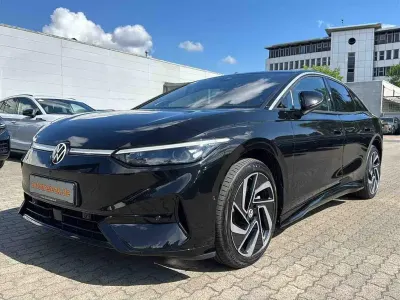 Gebraucht VW ID.7 Pro 210 kW (286 PS) 2023 Grenadillschwarz metallic Kleinwagen