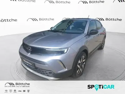 Gebraucht Opel Mokka-e Elegance 100 kW (136 PS) 2022 Kontrast grau/quarz silber SUV