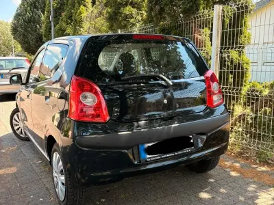 Gebraucht Nissan Pixo 68 PS (50 kW) 2010 Schwarz Kleinwagen