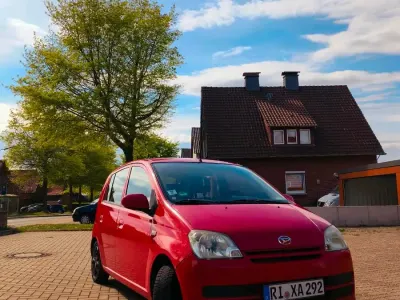 Gebraucht Daihatsu Cuore 58 PS (42 kW) 2006 Rot Kleinwagen