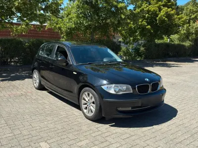 Gebraucht BMW 116 122 PS (89 kW) 2009 Schwarz Kleinwagen