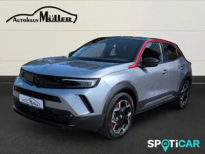 Gebraucht Opel Mokka-e GS Line 100 kW (136 PS) 2022 Kontrast grau/quarz silber SUV