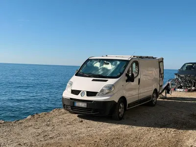 Gebraucht Renault Trafic 114 PS (83 kW) 2011 Weiß Van / Kleinbus
