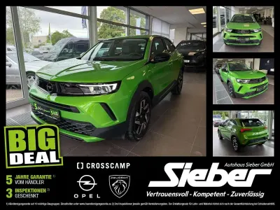 Gebraucht Opel Mokka Elegance 131 PS (96 kW) 2024 Lackierung matcha green/typ au SUV