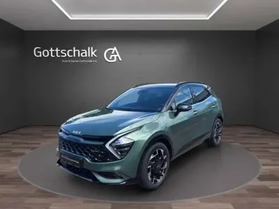 Gebraucht Kia Sportage 179 PS (131 kW) 2023 Experience green metallic (metallic) SUV