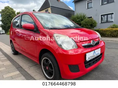 Gebraucht Daihatsu Cuore 69 PS (50 kW) 2011 Rot Kleinwagen