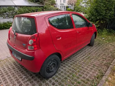 Gebraucht Nissan Pixo 68 PS (50 kW) 2009 Rot Kleinwagen
