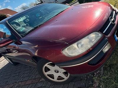 Second-hand Opel Omega 116 CP (85 kW) 1997 Roșu Berlinǎ