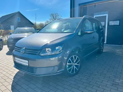 Begagnad VW Touran Comfortline 105 HK (77 kW) 2011 Grå Minibuss
