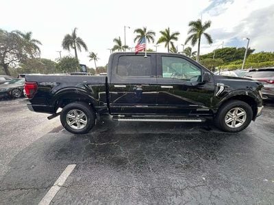 Gebraucht Ford F-150 XLT 436 PS (320 kW) 2024 Agate black metallic Pickup