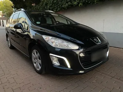 Gebraucht Peugeot 308 SW 112 PS (82 kW) 2011 Schwarz Kombi