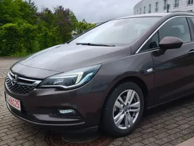 Używany Opel Astra Business 110 KM (80 kW) 2016 Brązowy Sedan/Limuzyna