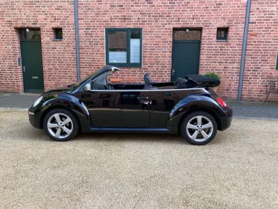 Gebraucht VW New Beetle 102 PS (75 kW) 2010 Schwarz Kleinwagen