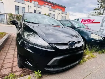 Używany Ford Fiesta 60 KM (44 kW) 2011 Czarny Sedan/Limuzyna