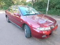 Gebraucht Mitsubishi Carisma 125 PS (91 kW) 1998 Rot Limousine