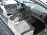 Używany Mazda 323 Comfort 72 KM (52 kW) 2001 Srebrny Sedan/Limuzyna