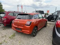 Gebraucht Suzuki Swift Comfort+ 83 PS (61 kW) 2024 Flame orange pearl metallic Kleinwagen
