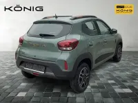 Gebraucht Dacia Spring Extreme 47 kW (65 PS) 2023 Olivgrün Kleinwagen