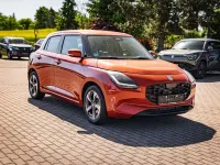 Gebraucht Suzuki Swift Comfort+ 83 PS (61 kW) 2024 Flame orange pearl metallic Kleinwagen