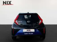 Gebraucht Toyota Aygo X 72 PS (52 kW) 2025 Juniperblue / black mica SUV