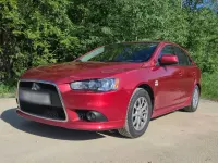 Gebraucht Mitsubishi Lancer 143 PS (105 kW) 2010 Rot Limousine