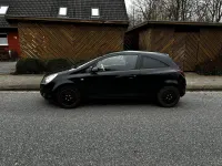 Używany Opel Corsa 90 KM (66 kW) 2009 Czarny Hatchback