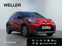 Gebraucht Toyota Aygo Team 72 PS (52 kW) 2024 Chili red / dach black mica (rot) Kleinwagen