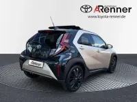 Gebraucht Toyota Aygo X Style 72 PS (52 kW) 2022 Ginger beige metallic/ night sky black SUV