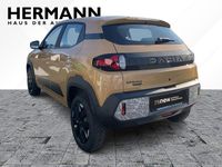 Gebraucht Dacia Spring Extreme 47 kW (65 PS) 2024 Safaribeige (beige) Kleinwagen