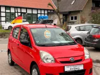 Gebraucht Daihatsu Cuore 69 PS (50 kW) 2010 Rot Kleinwagen