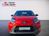 Gebraucht Toyota Aygo X Pulse 72 PS (52 kW) 2023 Chili red perleffekt/ night sky black SUV