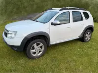 Używany Dacia Duster Prestige 105 KM (77 kW) 2011 Biały SUV