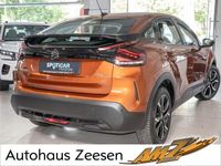 Gebraucht Citroën e-C4 Feel 100 kW (136 PS) 2022 Karamellbraun (metallic) Limousine