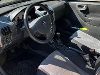 Używany Opel Corsa 80 KM (58 kW) 2006 Srebrny Hatchback